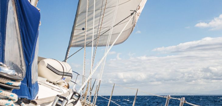 Section of a sailing ship on the sea with a blue sky