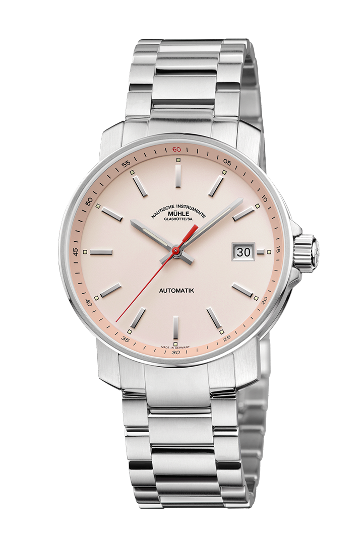 29er apricot: Frontalansicht einer Armbanduhr mit einem apricotfarbenem Zifferblatt, silbernem Gehäuse und Metallband.