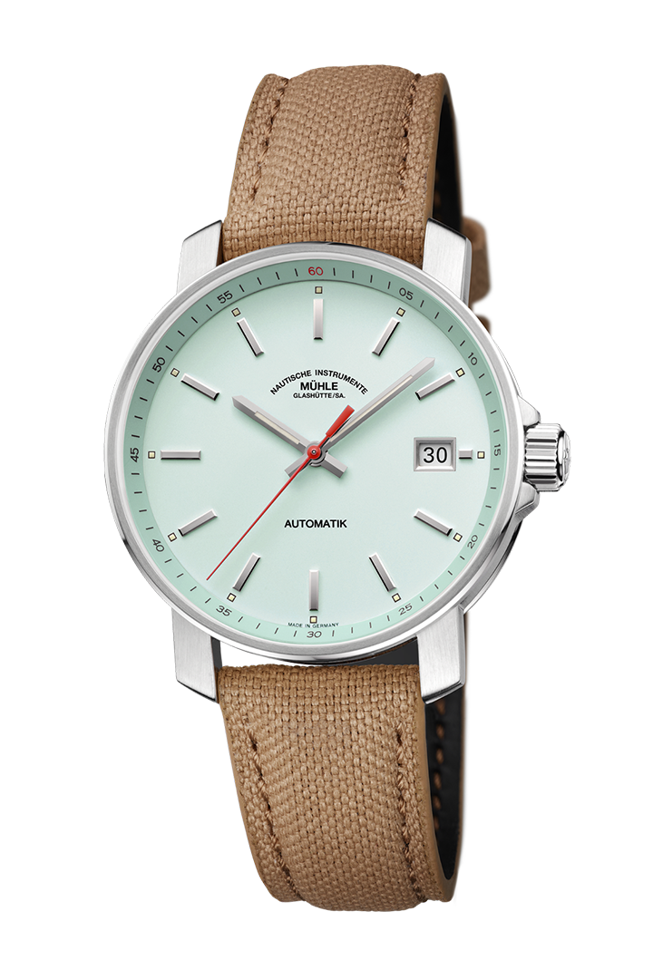 29er mint: Frontalansicht einer Armbanduhr mit einem mintgrünen Zifferblatt, silbernem Gehäuse und sandfarbenem Canvasband.