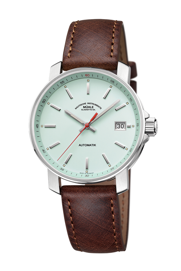 29er mint: Frontalansicht einer Armbanduhr mit einem mintgrünen Zifferblatt, silbernem Gehäuse und braunem Lederband.