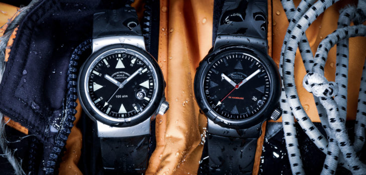 Zwei Armbanduhren - der S.A.R. Rescue-Timer und der S.A.R. Rescue-Timer Black Edition - liegen auf einem orangen Tuch.