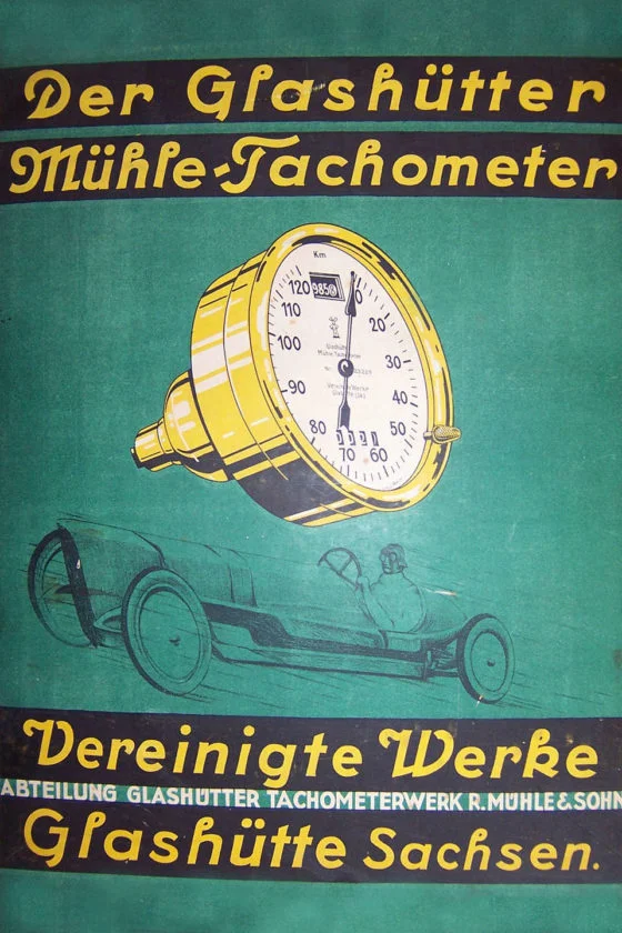Historische Werbeanzeige eines gelben Tachometers auf türkisem Untergrund mit gelber Schrift.